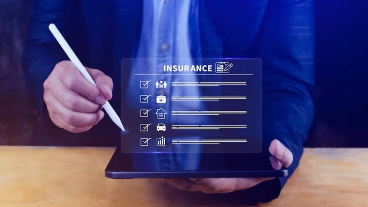 A person holding a tablet with a checklist for various insurances, using a stylus to mark items off the list.
