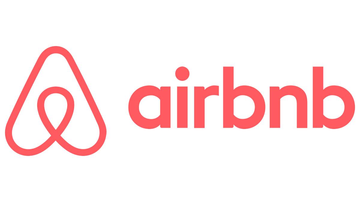 Airbnb logo featuring a stylized A in coral color alongside the word airbnb in matching font.